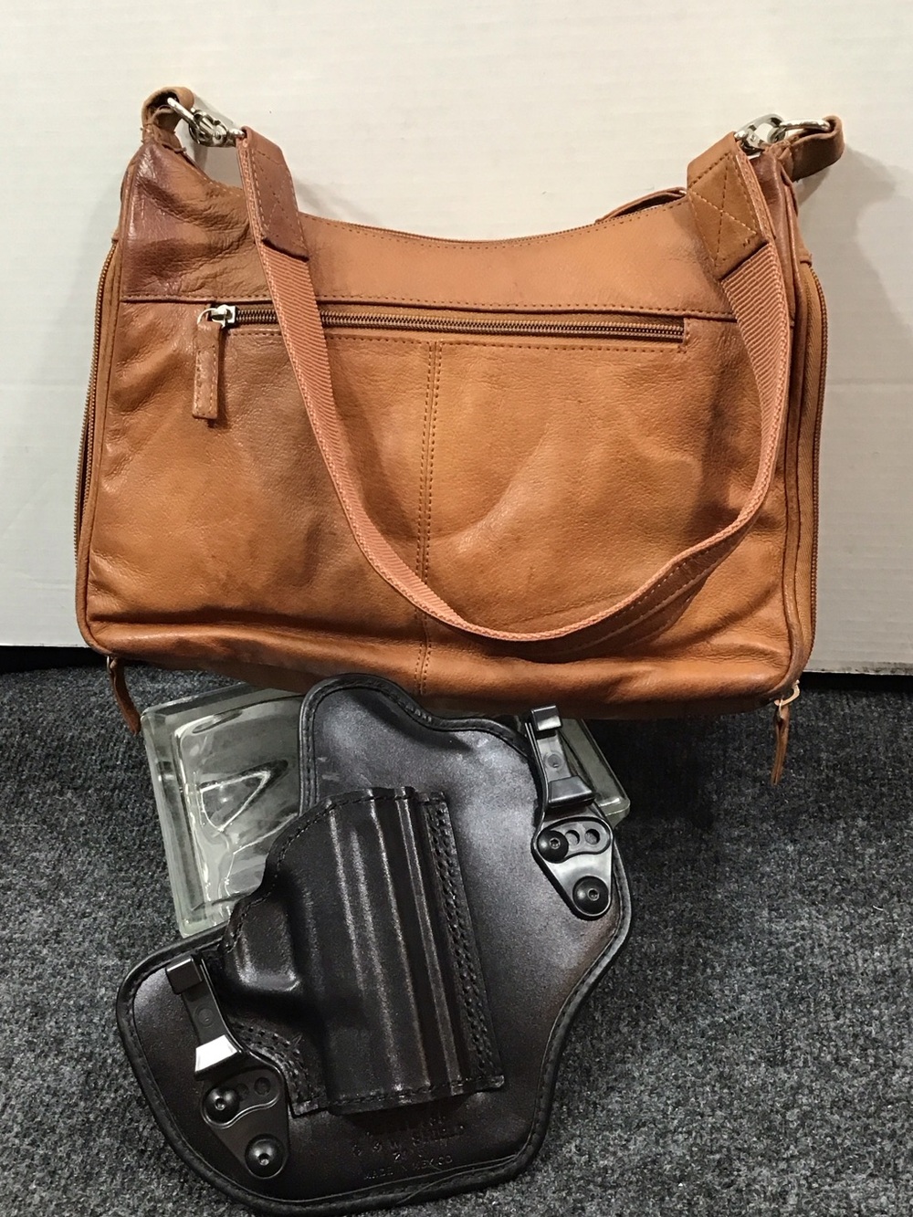 Gun Tote’n Mama tan leather shoulder bag with holster